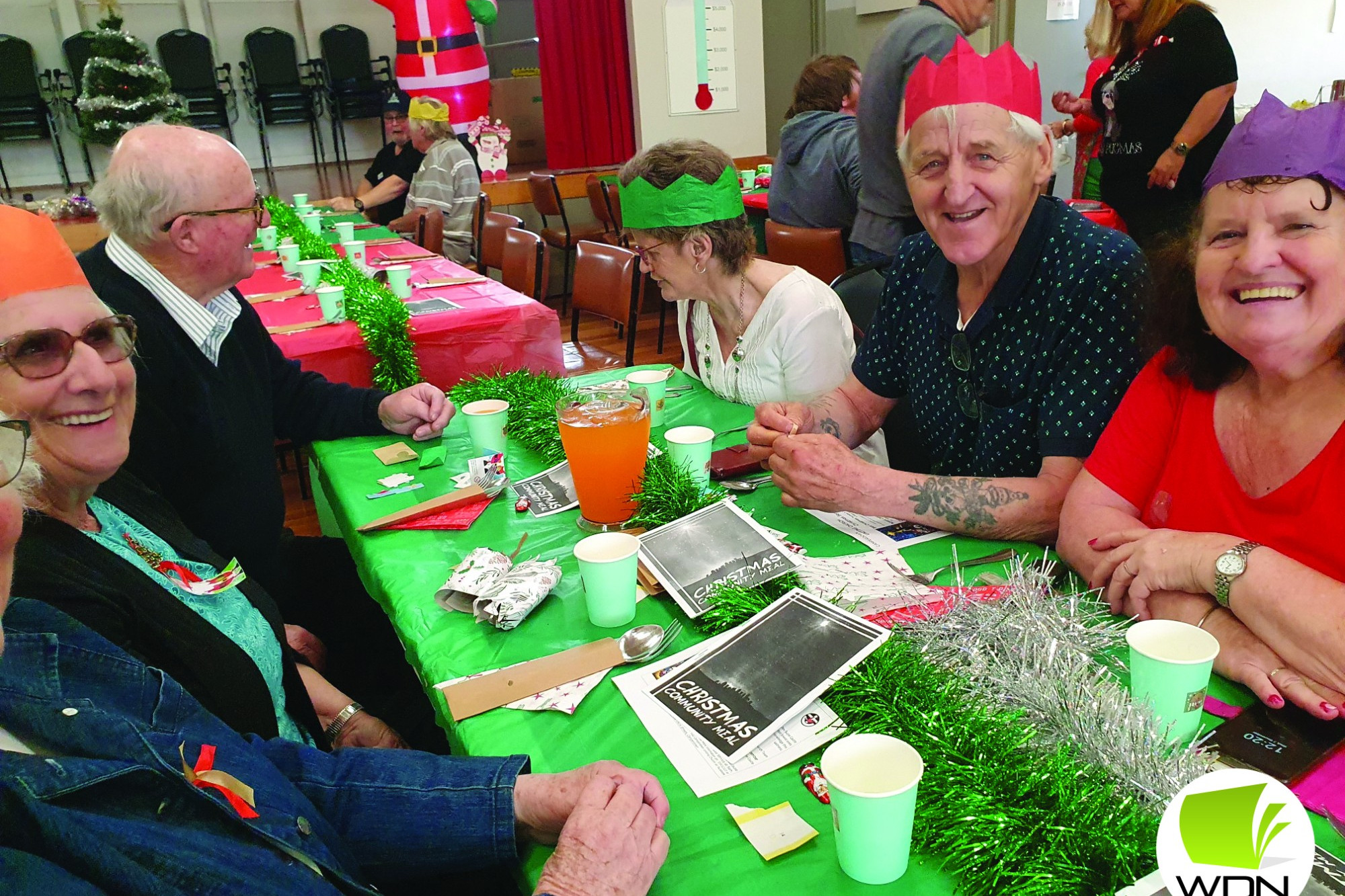 Christmas spirit: Locals sat down for a community Christmas lunch last week thanks to the Camperdown Uniting Church and a group of volunteers.