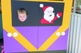  Emmett Gladman tries out the V/Line photo booth.