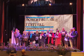The Festival Community Choir performs together.
