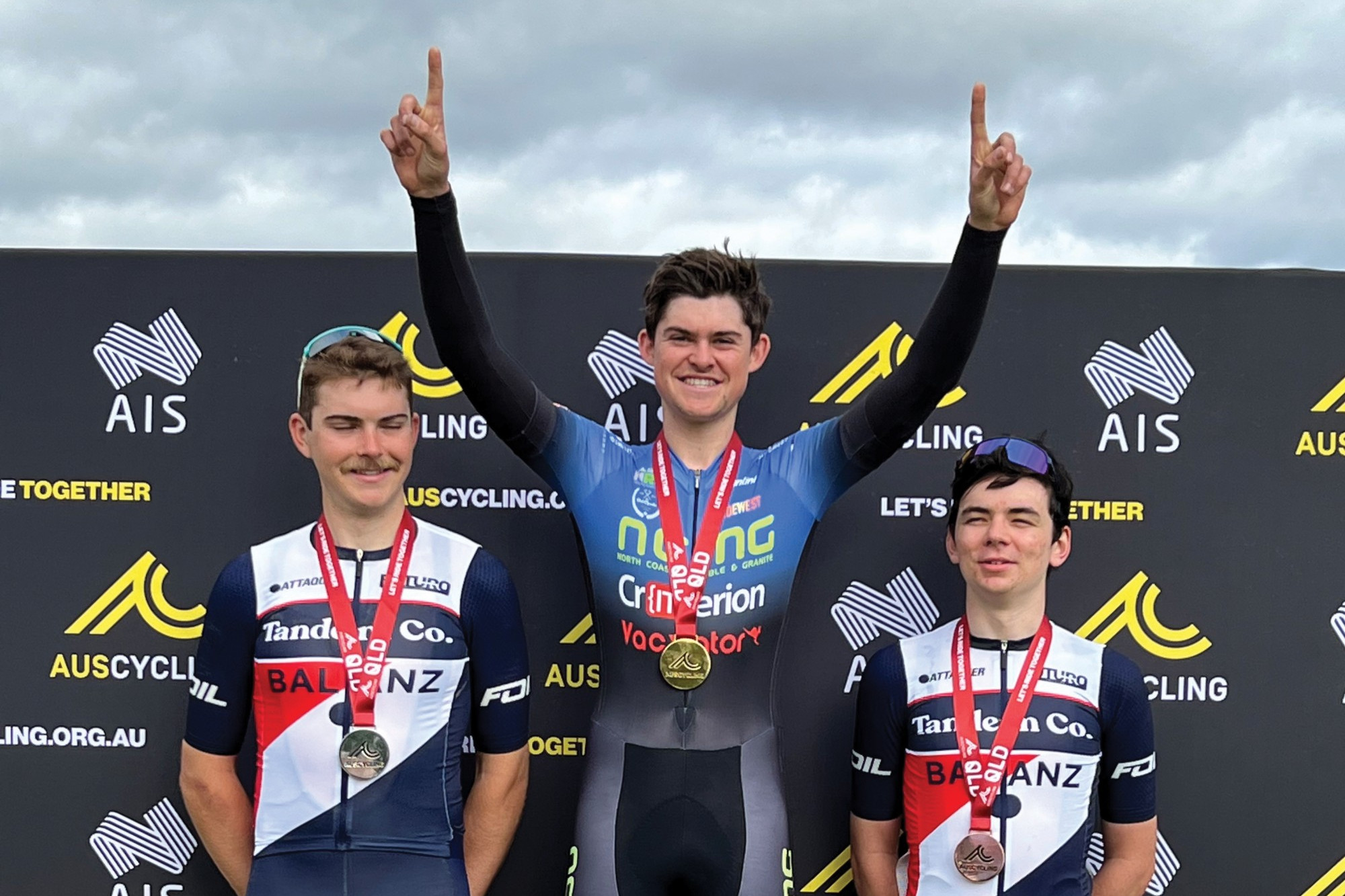 Podium: Camperdown’s Bailey McDonald (centre) celebrates victory following a tough 95-kilometers on the weekend.