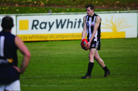 Ethan Coates takes aim from a long-distance set shot. 