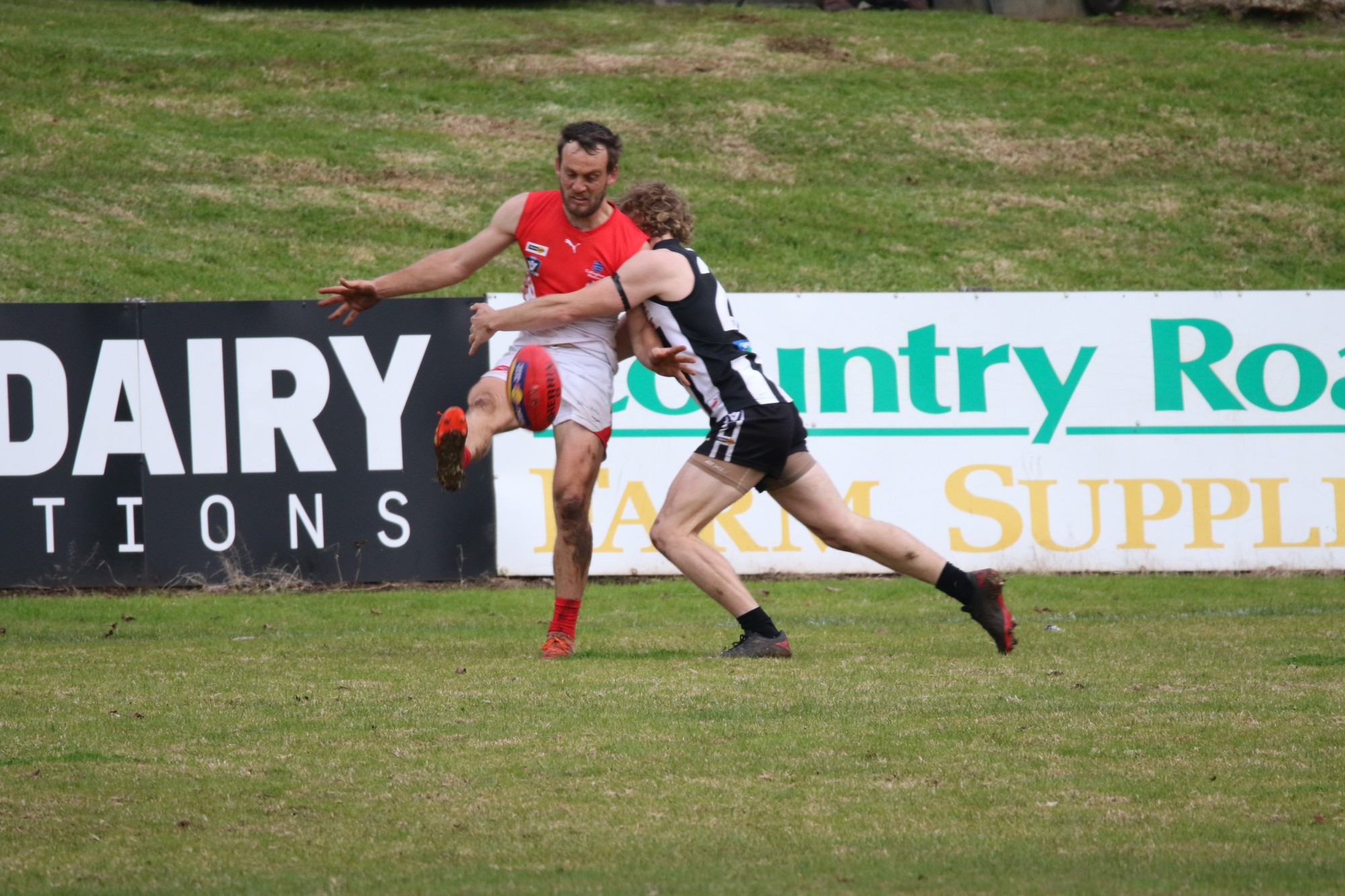 Tough: Josh Place puts a strong tackle on his South opponent.