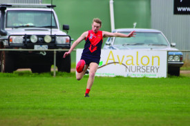 Demons star Darcy Robinson sends the ball down field.