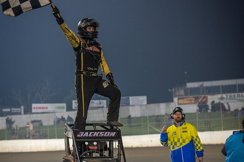 Right: Matt Jackson celebrates his triumph after winning the 2022 Victorian Speedway Championship ahead of multiple title winner Travis Mills. Photo by Aidan Freeman.