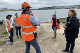 Contractors brief Minister for Fishing and Boating Melissa Horne (right) at an on-site meeting Tuesday. 