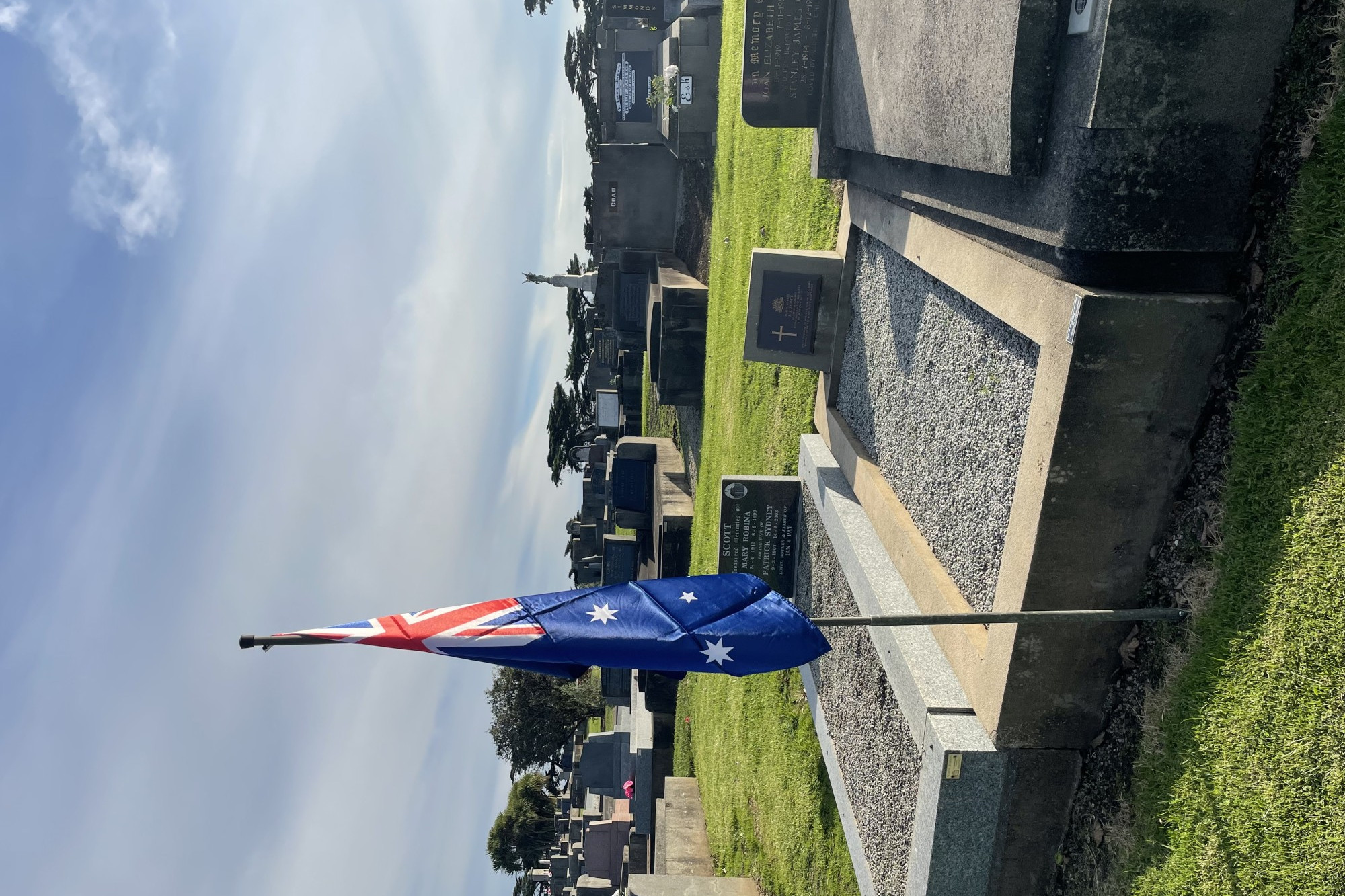 Lest we forget: An Australian flag has been raised near the grave of veteran Ian Scott to commemorate 54 years since he was killed in action.