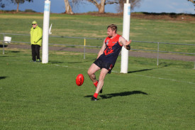 Andrew Parkinson clears the ball from the back pocket. 