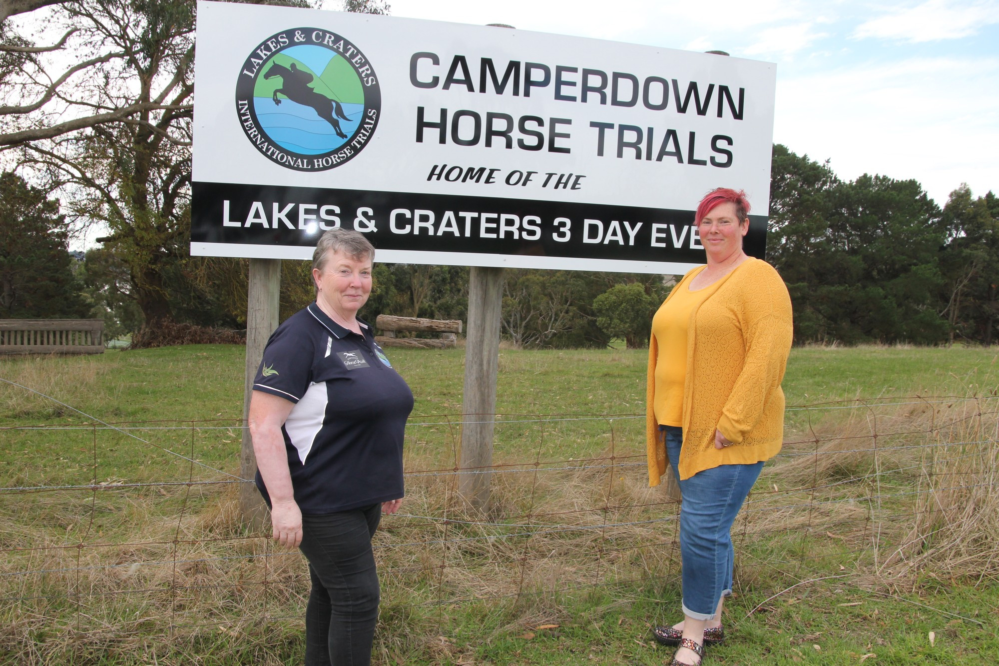 Camperdown Horse Trials secretary Teresa Matthews (left) and president Kristie Coverdale welcomed the addition of a new sign at the Lakes Sporting Club complex.