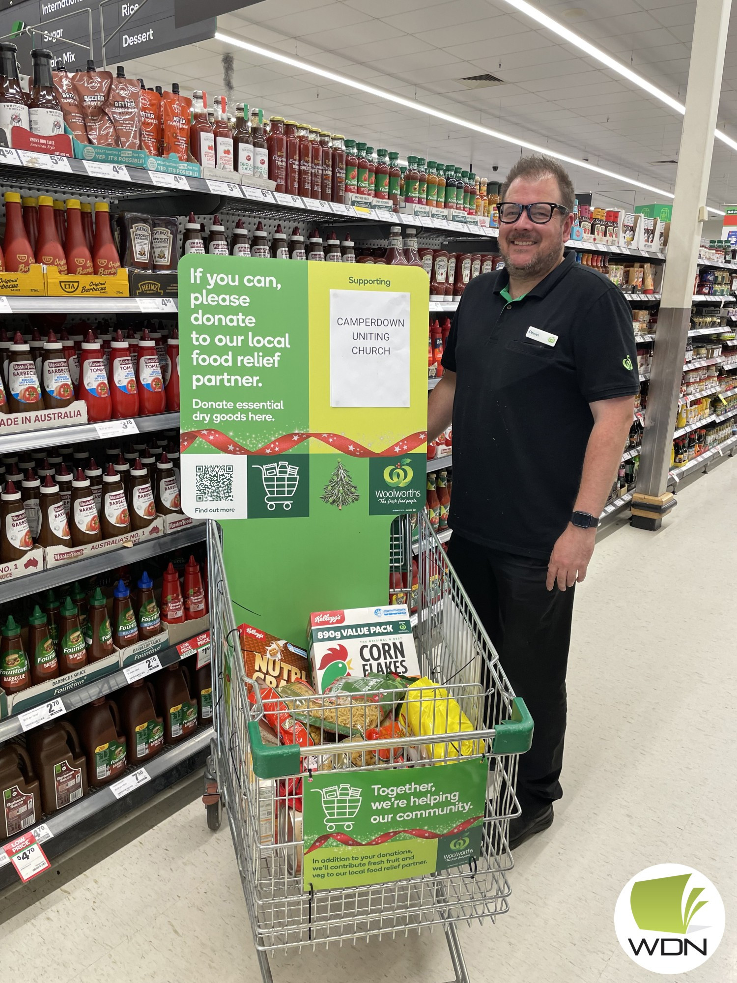 Supporting each other: Woolworths Camperdown manager Daniel Kardas is urging local shoppers to support a food drive which will be directed to locals in need.