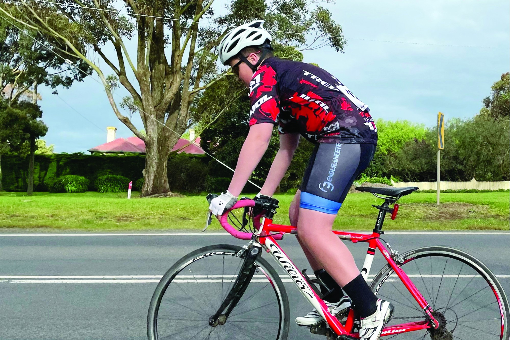 Finn Baxter crosses the line in first place.