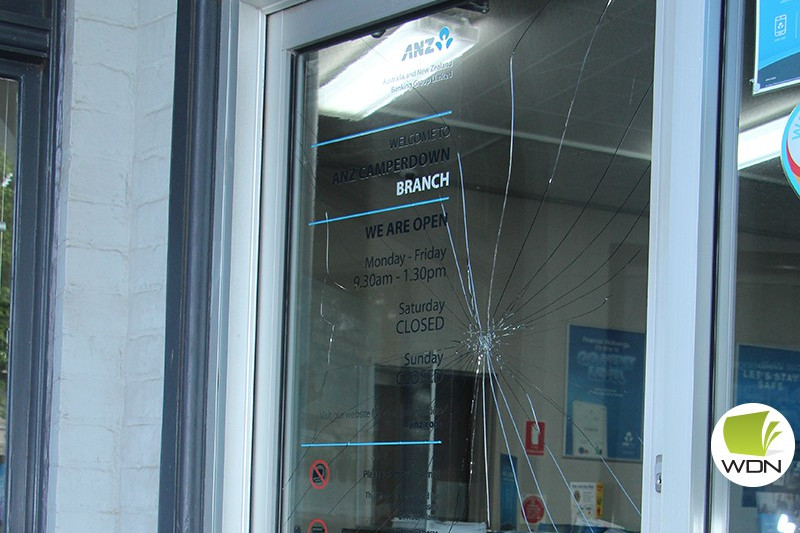 Witnesses wanted: Police are investigating a smashed door at the Camperdown ANZ which occurred last week.