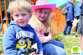 George French, 4, and Charli French, 6, enjoy the petting zoo. 