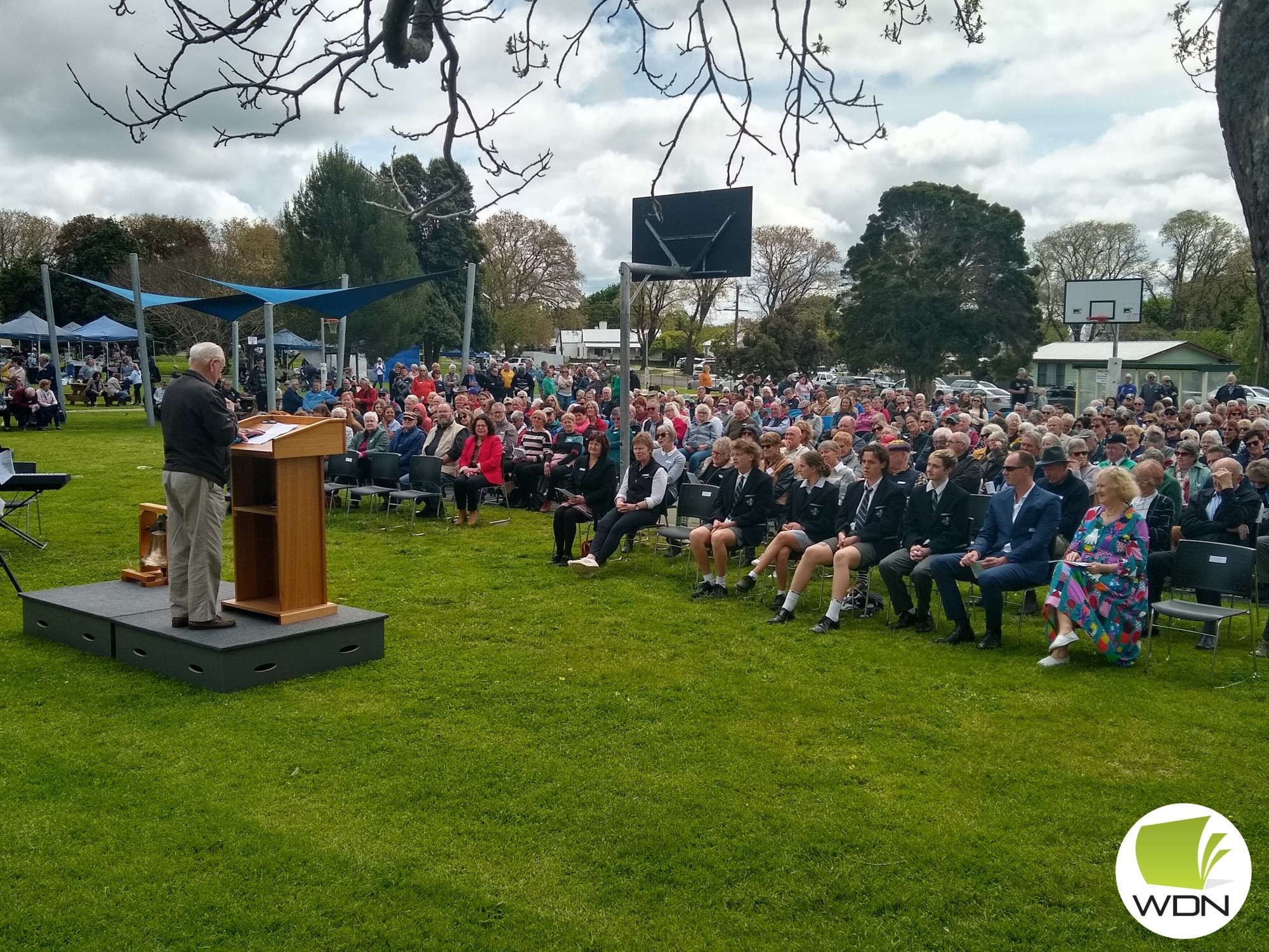 Alan Fleming, a student in the 1950s and 1960s wearing his school cap and tie at the event.