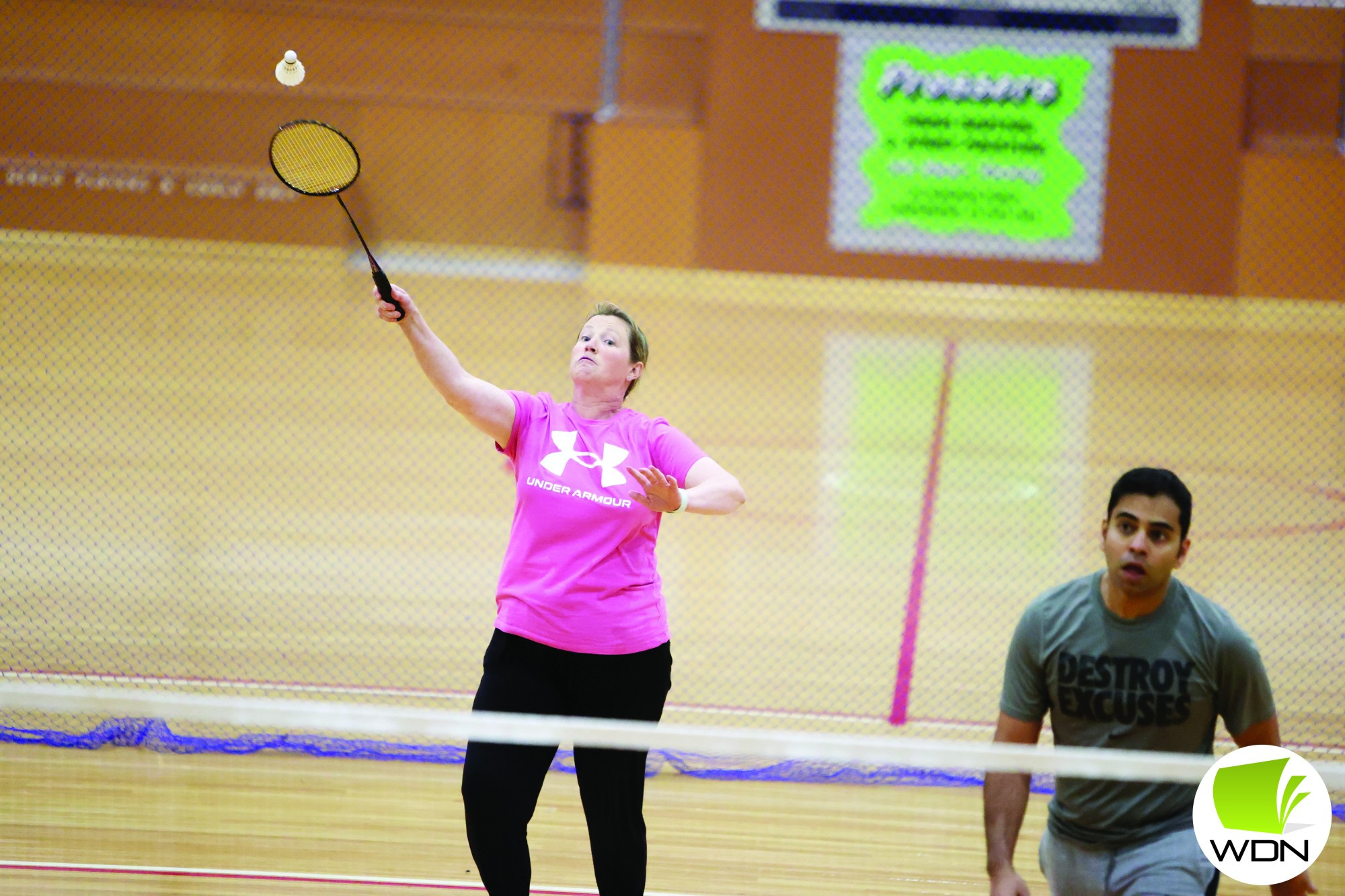 Jedda Couch smashes back shuttle for a winning point.