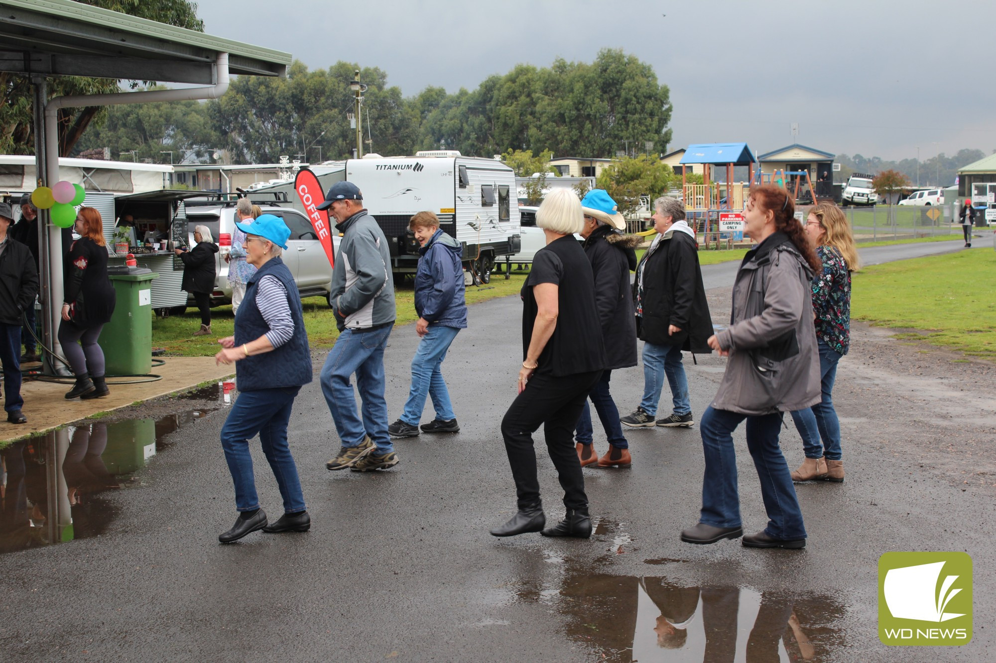 Dancing in the drizzle: Despite less-than-ideal weather, music-lovers enjoyed a day of music at Lake Purrumbete.