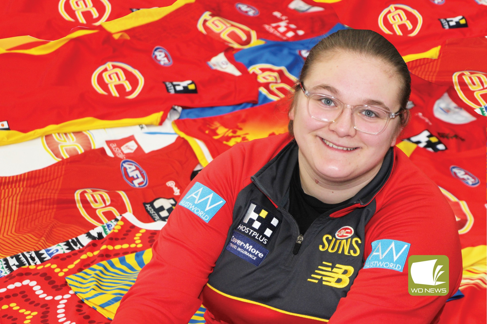 “I thought it was cool”: Suns cheer squad member Hayley Riches (pictured with her collection of football jerseys) has been recognised for her dedication to the Gold Coast Suns.