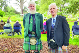 Norman Mcdonald and Dr John Menzies OAM don their kilts. 
