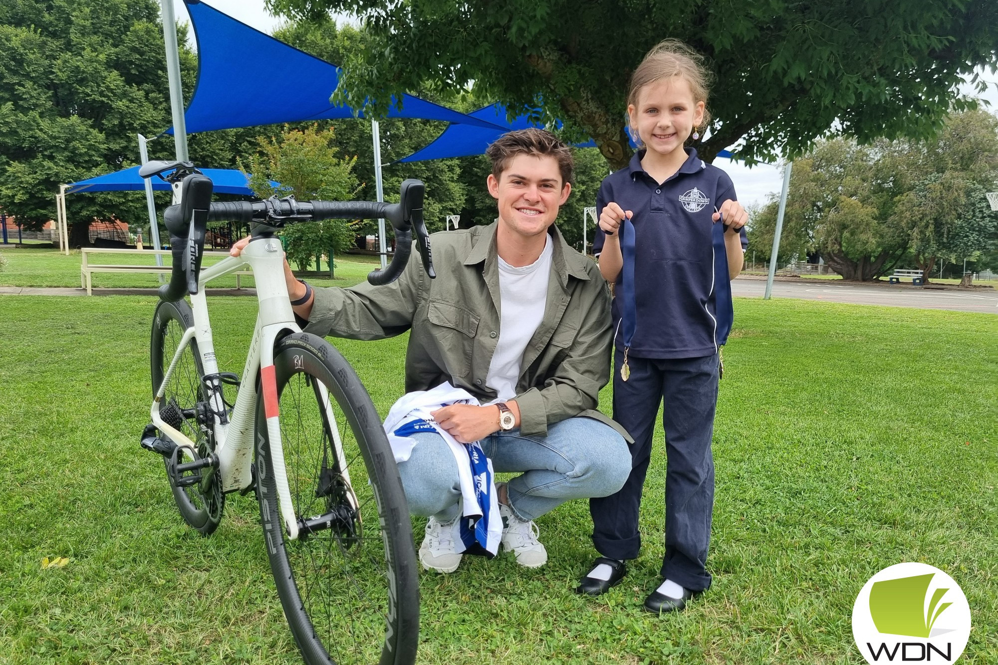 Imogen Donlan was keen to take a closer look at Bailey’s bike and medal.