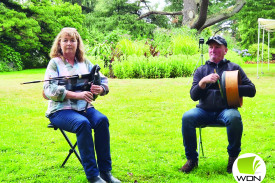 Peter and Merran Moir play music for the crowd.