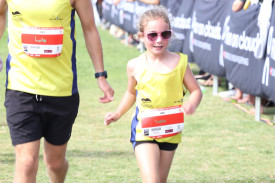 Camperdown’s Luke Woodmason crosses the line with seven year-old daughter Sophie. 