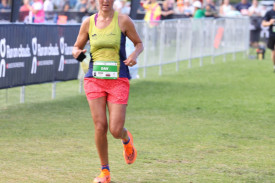 Davina Pickles crosses the finish line in the half marathon. 