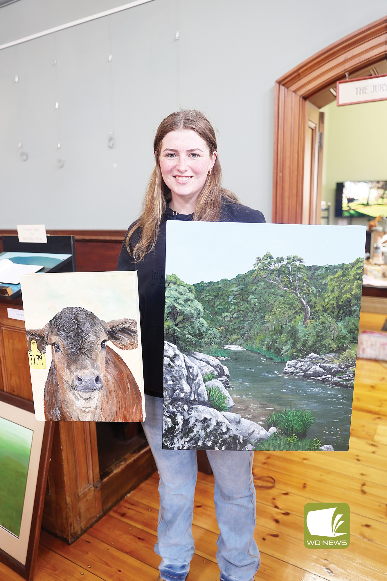 Life on canvas: Artist and local dairy farmer Caitlin Martin is showcasing her artworks of cattle and landscapes in the Courthouse this month.