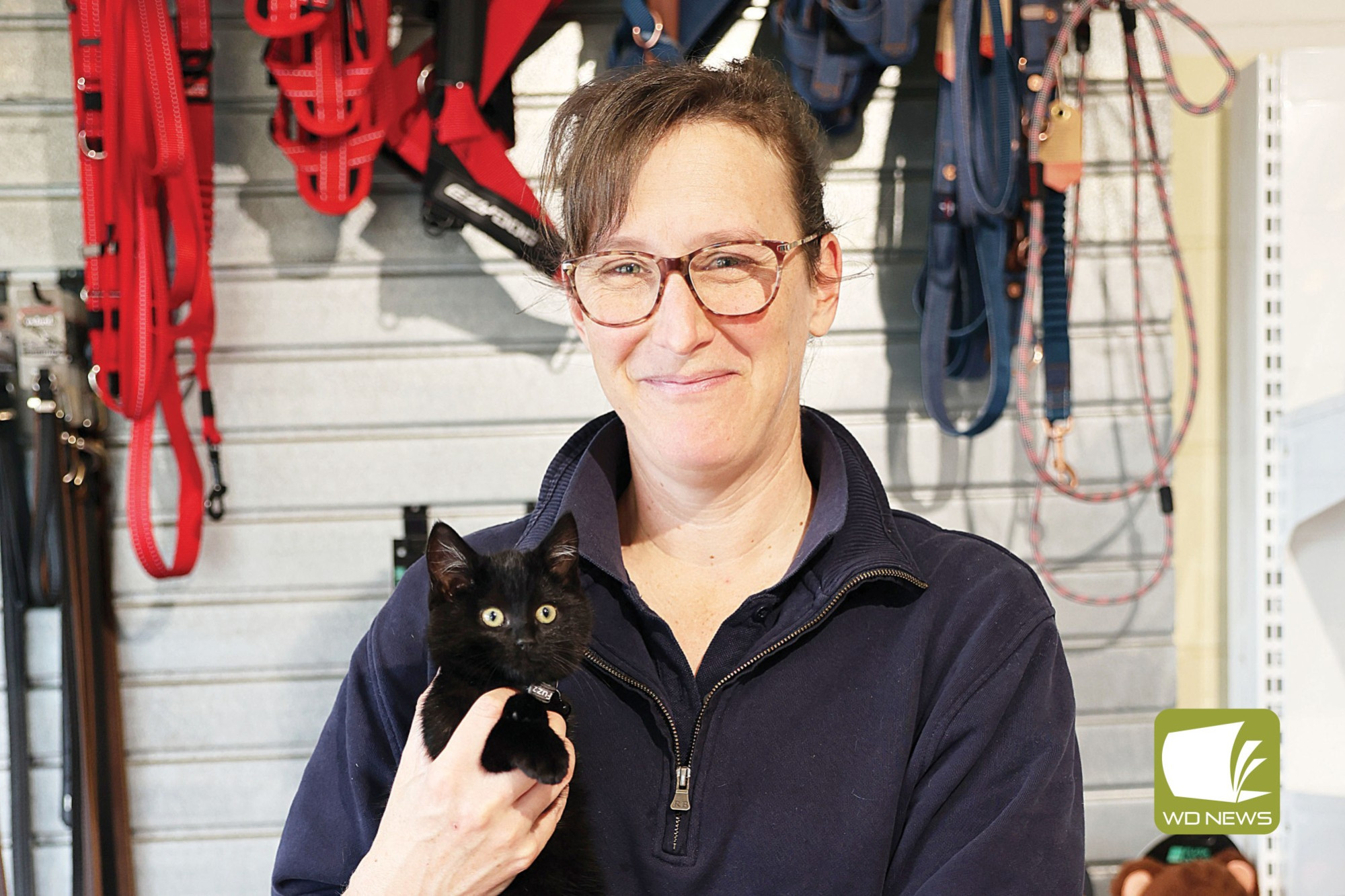 Helping the community: Camperdown Veterinary Centre vets, such as Angela Clifford (pictured with clinic pet cat Sooty), will work later to help working pet owners.