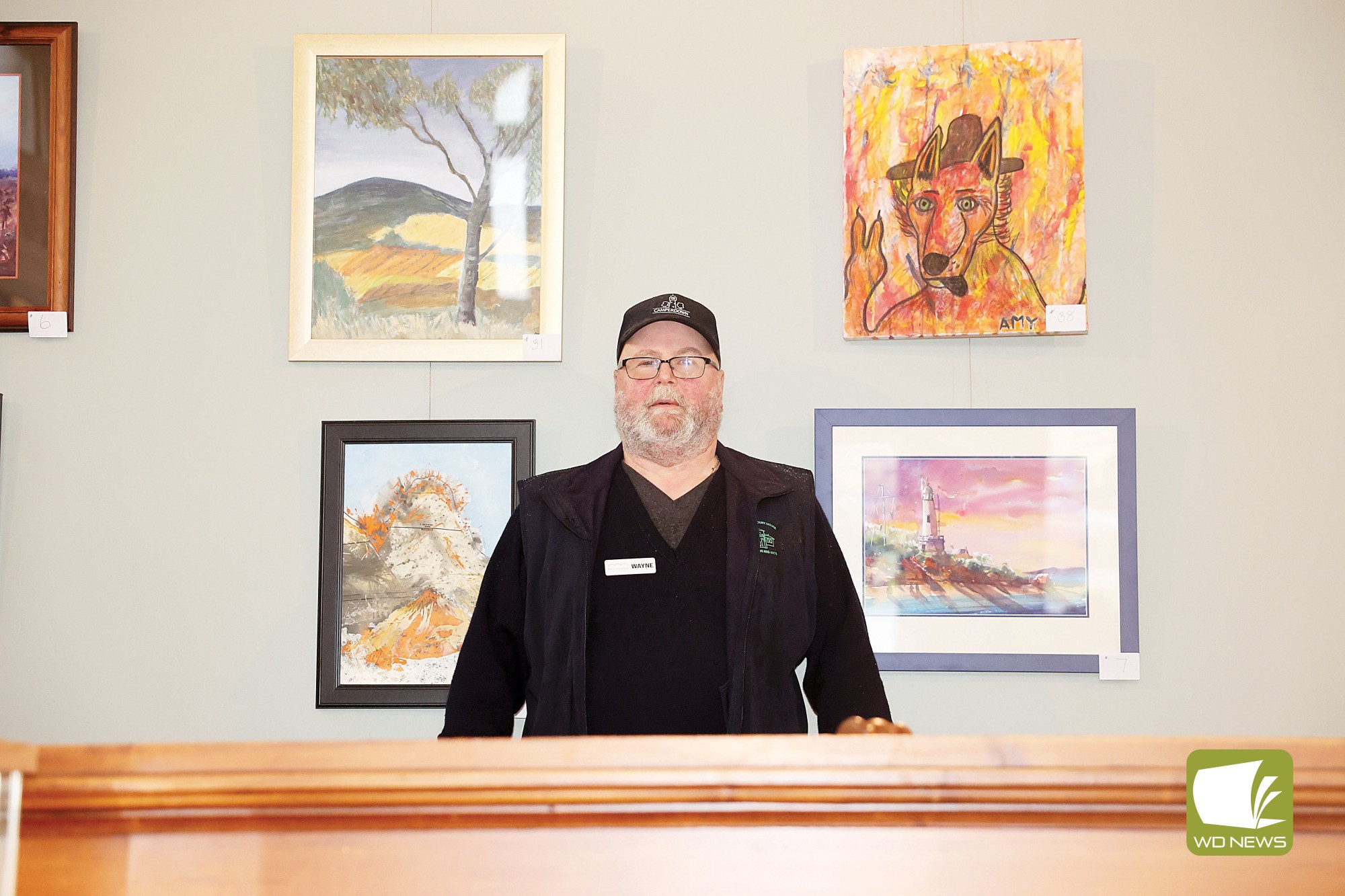 Local art on show: Courthouse volunteer Wayne with the various artworks on display for June.