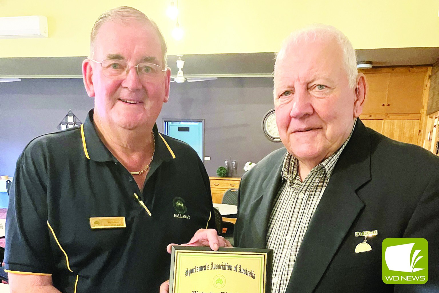 A delighted Peter Burke (right) was presented with a life membership to the Sportsman’s Association of Australia (Vic. Division) by Bill Watkins.