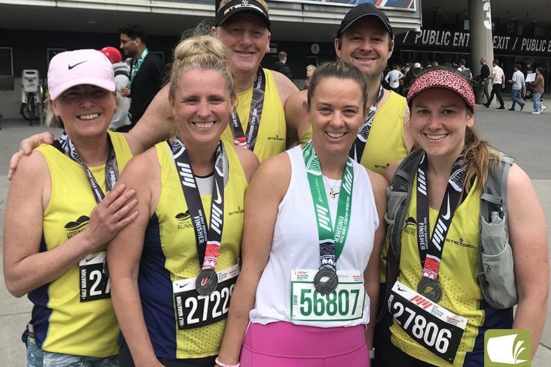 Camperdown’s Lakes and Craters Runners proudly wear their medals after competing in the Melbourne Running Festival.