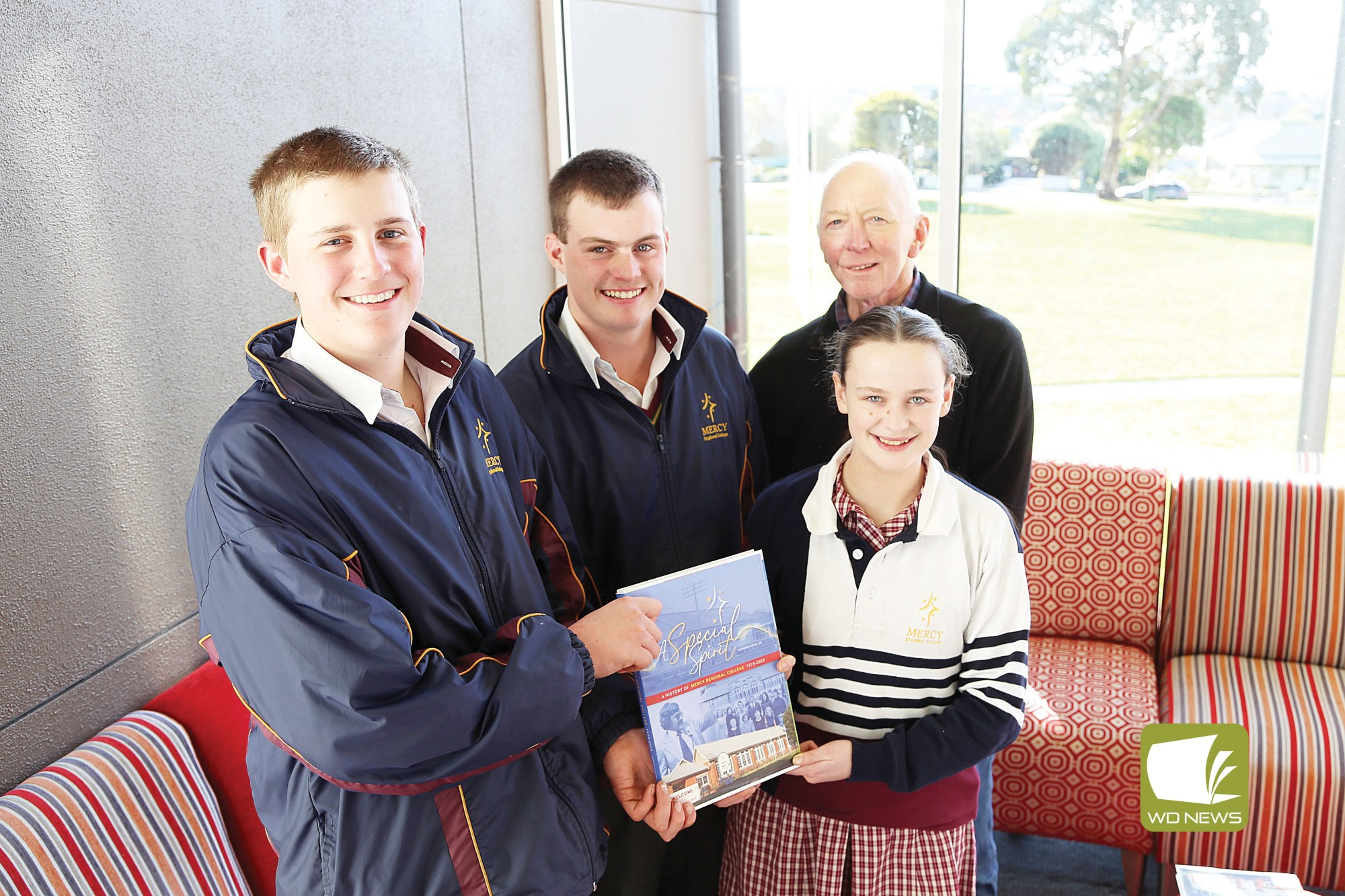 Preserving history: ‘A Special Spirit’ author Lachie Lee (with Tyler Lenssen, Hunter Bennett and Madidi McKenzie) is bringing Mercy Regioal College’s history to life.