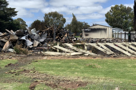 Rubble: All that is left of the property is a pile of tin and charred wood following Monday afternoon’s blaze. 