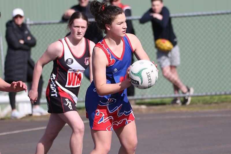 Defender Leah Dickson drives the ball down court at Friendly Societies Park.