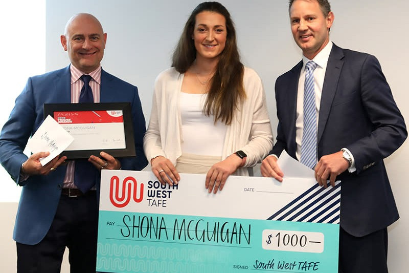 High achiever: Department of Education and Training executive director of TAFE Phil D’Adamo (left) and South West TAFE chief executive officer Mark Fidge (right) congratulated Noorat’s Shona McGuigan on receiving the Apprentice of the Year award at this year’s Trades Awards.