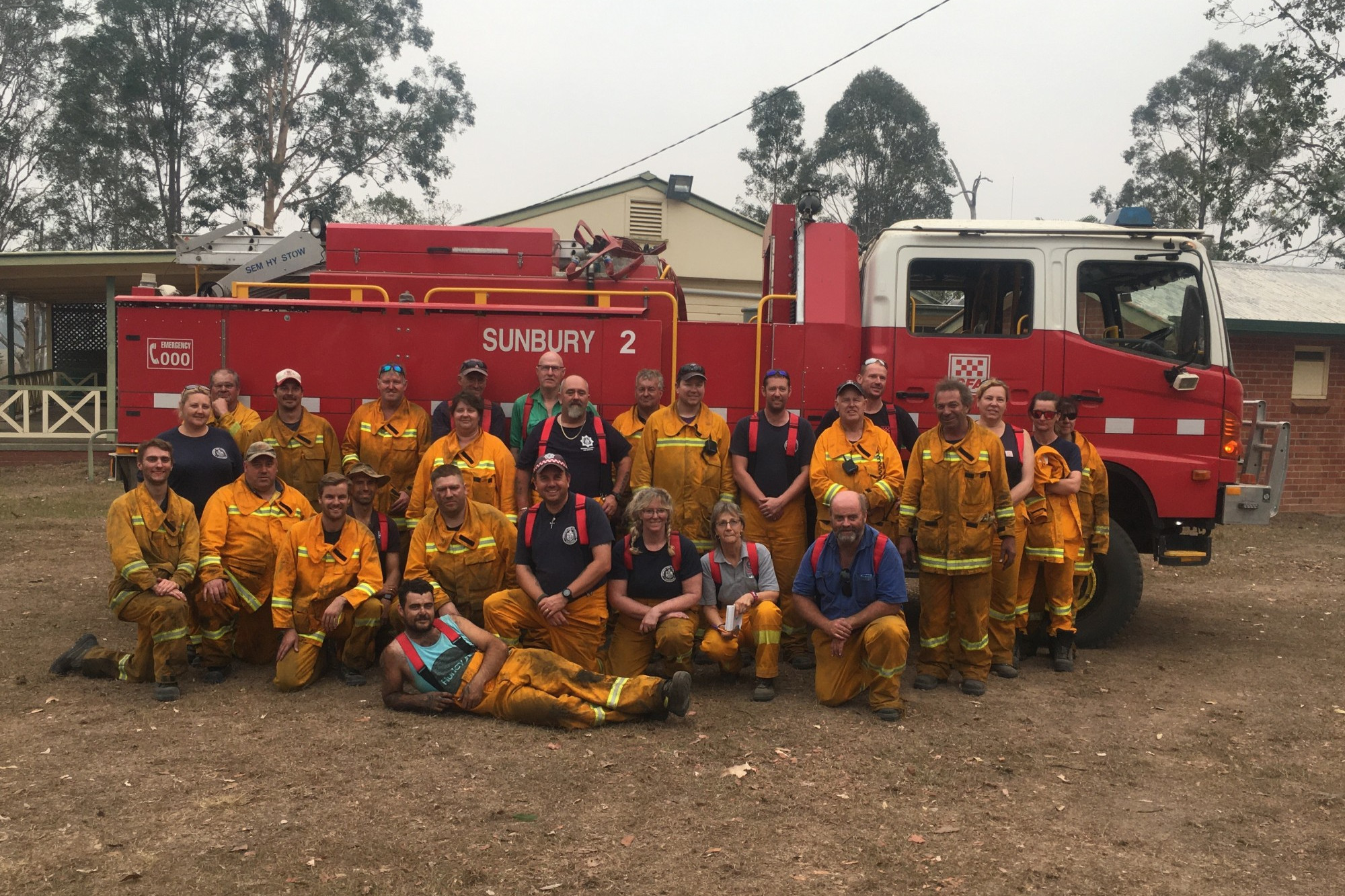 Team effort: Noorat Country Fire Authority brigade lieutenant Con Glennen (front, far right) was the strike team leader of a group of firefighters from districts six and seven tackling a fire in northern New South Wales.