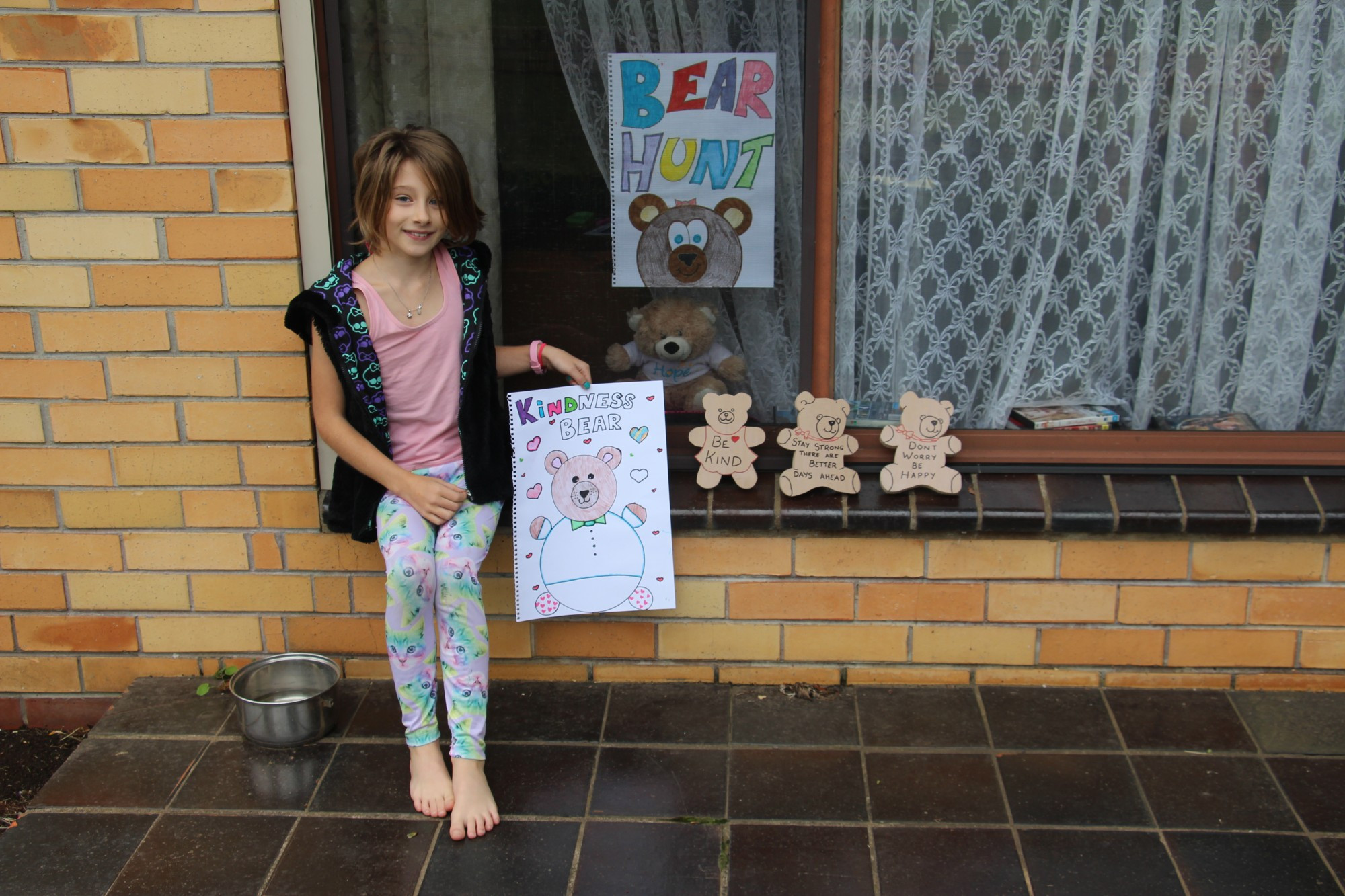 Lockdown fun: Terang residents including Sharni Rieniets (pictured) are placing teddy bears in their front windows as part of the ‘We’re Going On A Bear Hunt’ game sweeping the world.