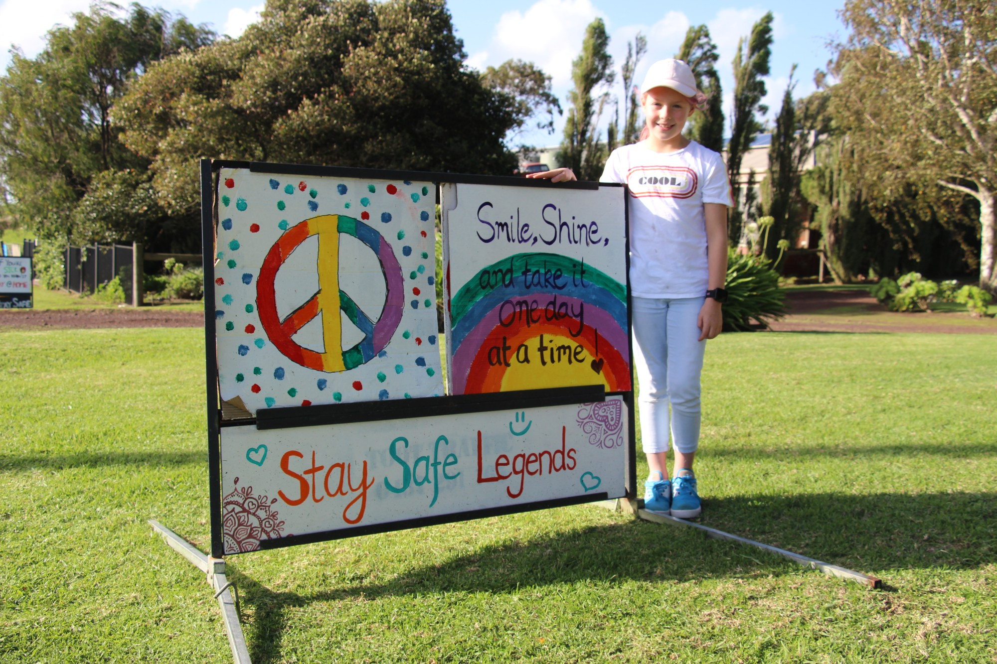 Kindness spreads: Messages of positivity are spreading around Terang, with Bella Scanlon repurposing road signs with the help of her Mum Kylie.