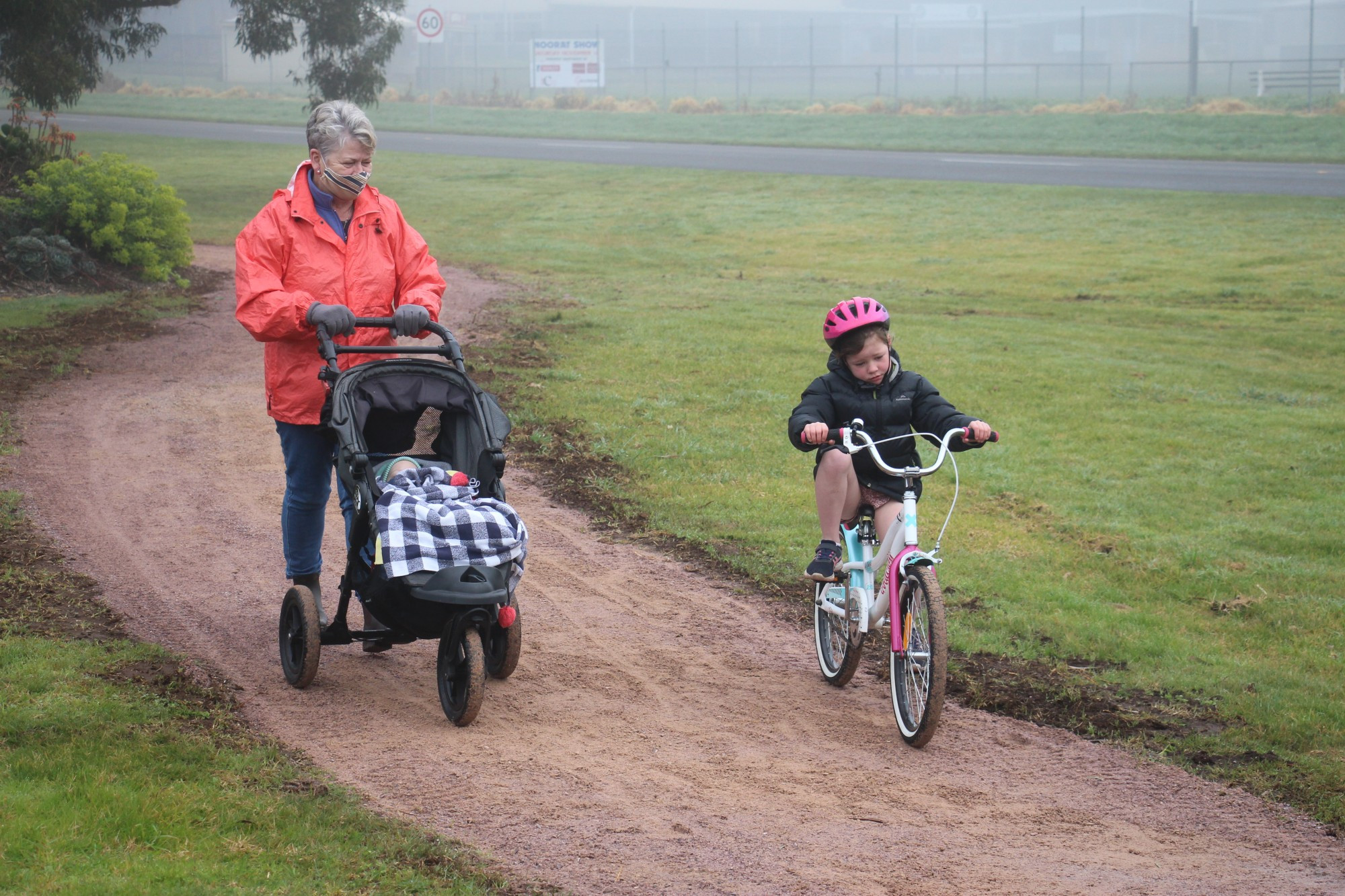 Top achievers: Noorat’s Anna Conheady, along with Charlie and Daisy Sargeant, enjoy a walk on the recently completed stage two extension of the Noorat Avenue footpath.
