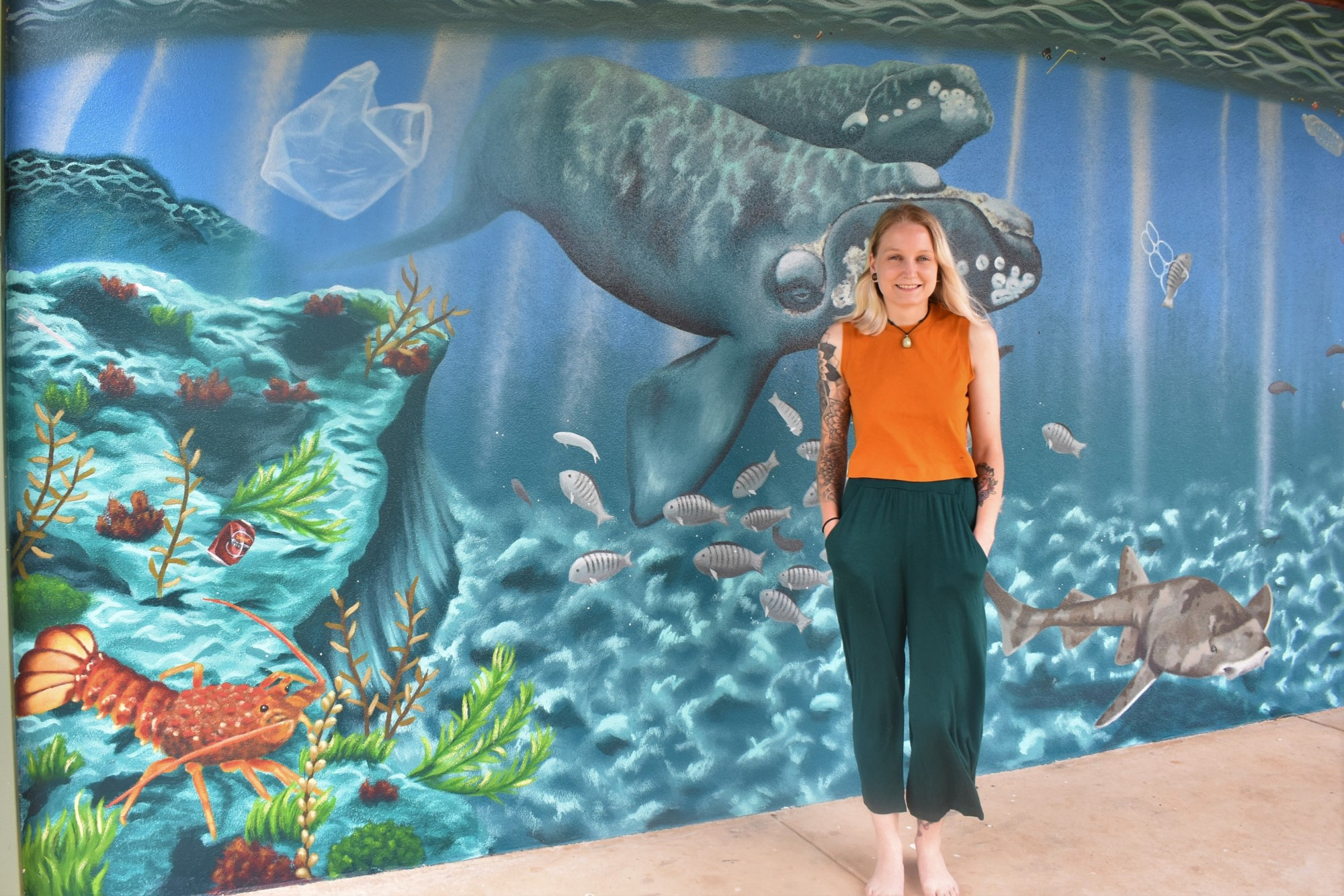 Painting to protect: Former Terang artist Alara Harris worked for about two months on a mural at Warrnambool’s Blue Hole car park which highlights the danger rubbish can pose to marine life.