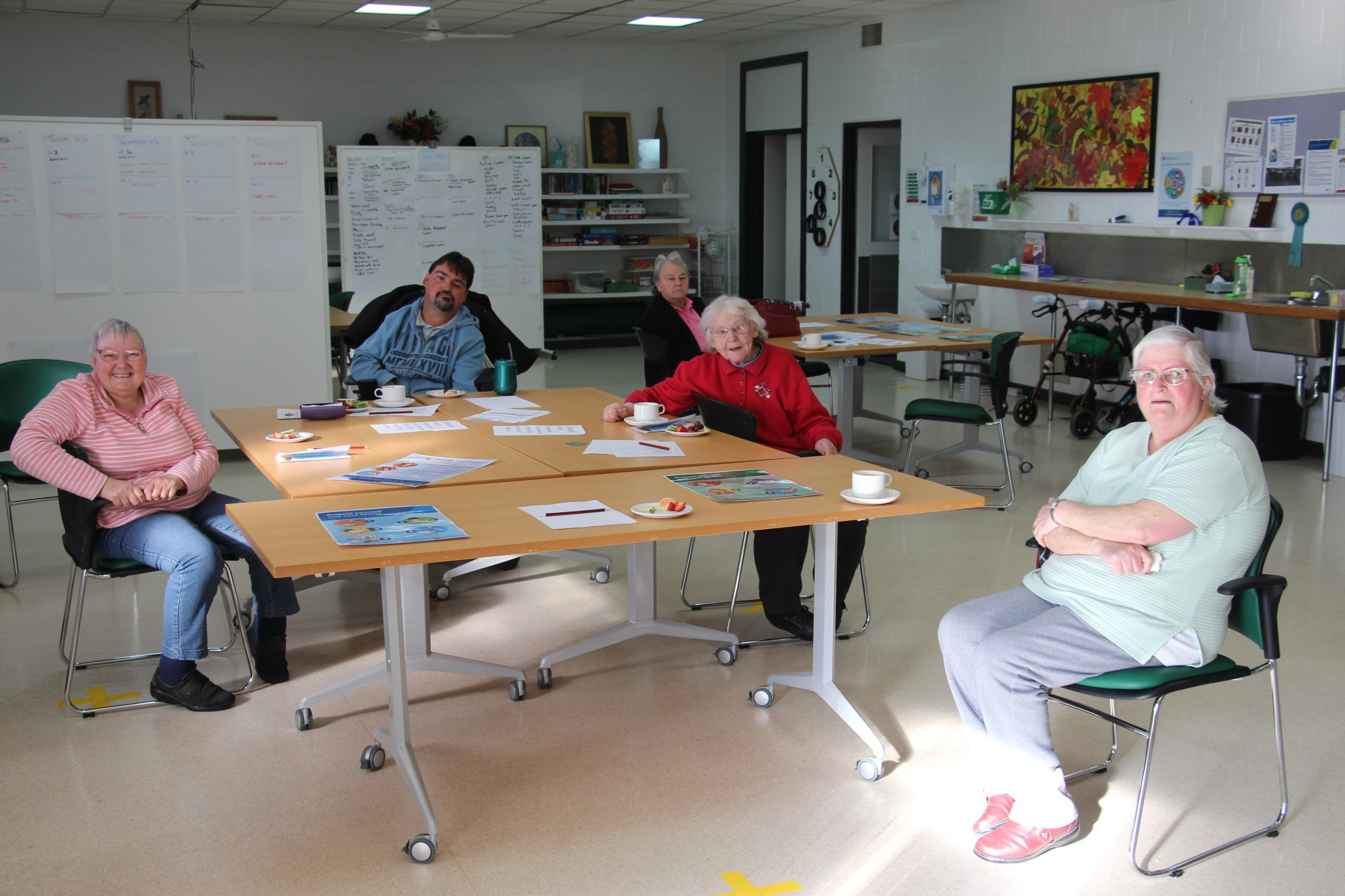 Activities galore: Planned activity groups enjoy afternoon tea at the Josie Black Community Health Centre for the first time since March on Tuesday.
