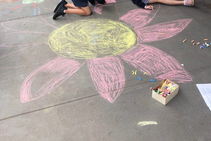 Positivity: Students from Terang College’s junior campus covered the footpath on High Street with messages of kindness and togetherness on Monday.