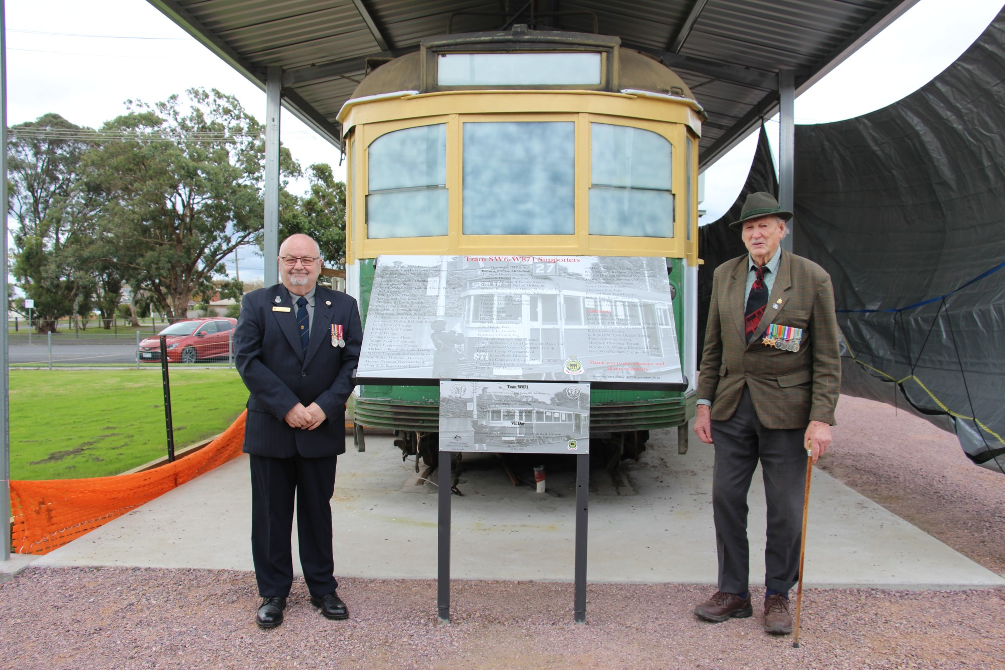 Fitting tribute: World War II veteran Len Pomeroy (right) unveiled a plaque commemorating Victory in Europe Day at the tram based at the RSL Hall in Terang with Terang sub-branch president Steve Bloxham.