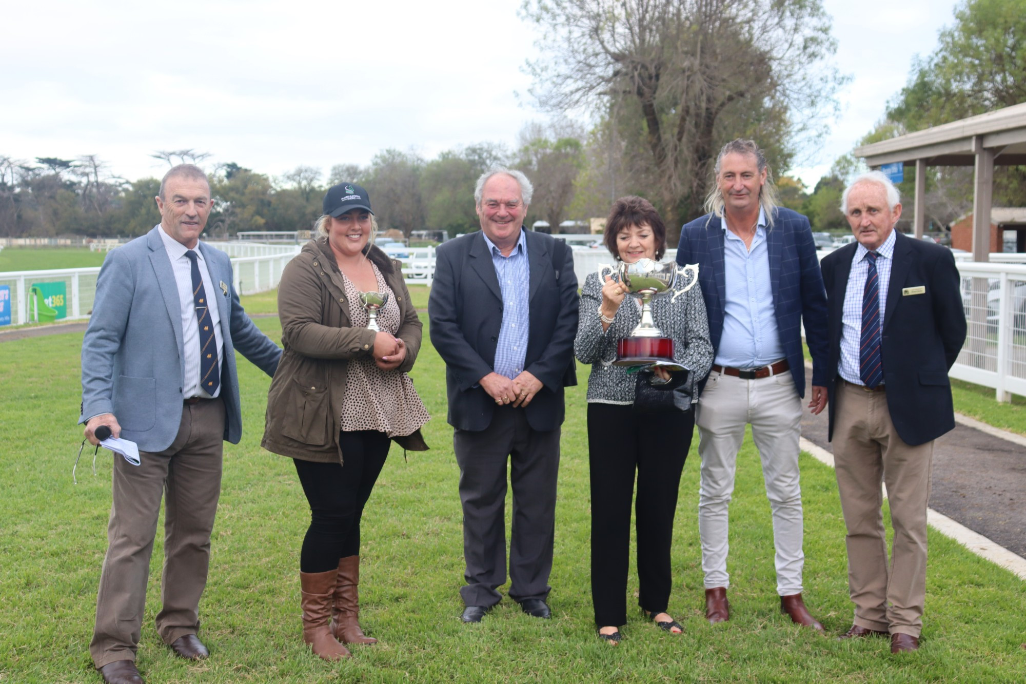 Victory: Terang and District Racing Club president Wayne Johnstone, trainer Maddie Raymond, owners Glen and Jane Davis, Sungold Milk representative Darryl Perry and racing club vice president Shane Scally celebrate Wentwood’s win in Sunday’s $70,000 Sungold Milk Terang Cup.