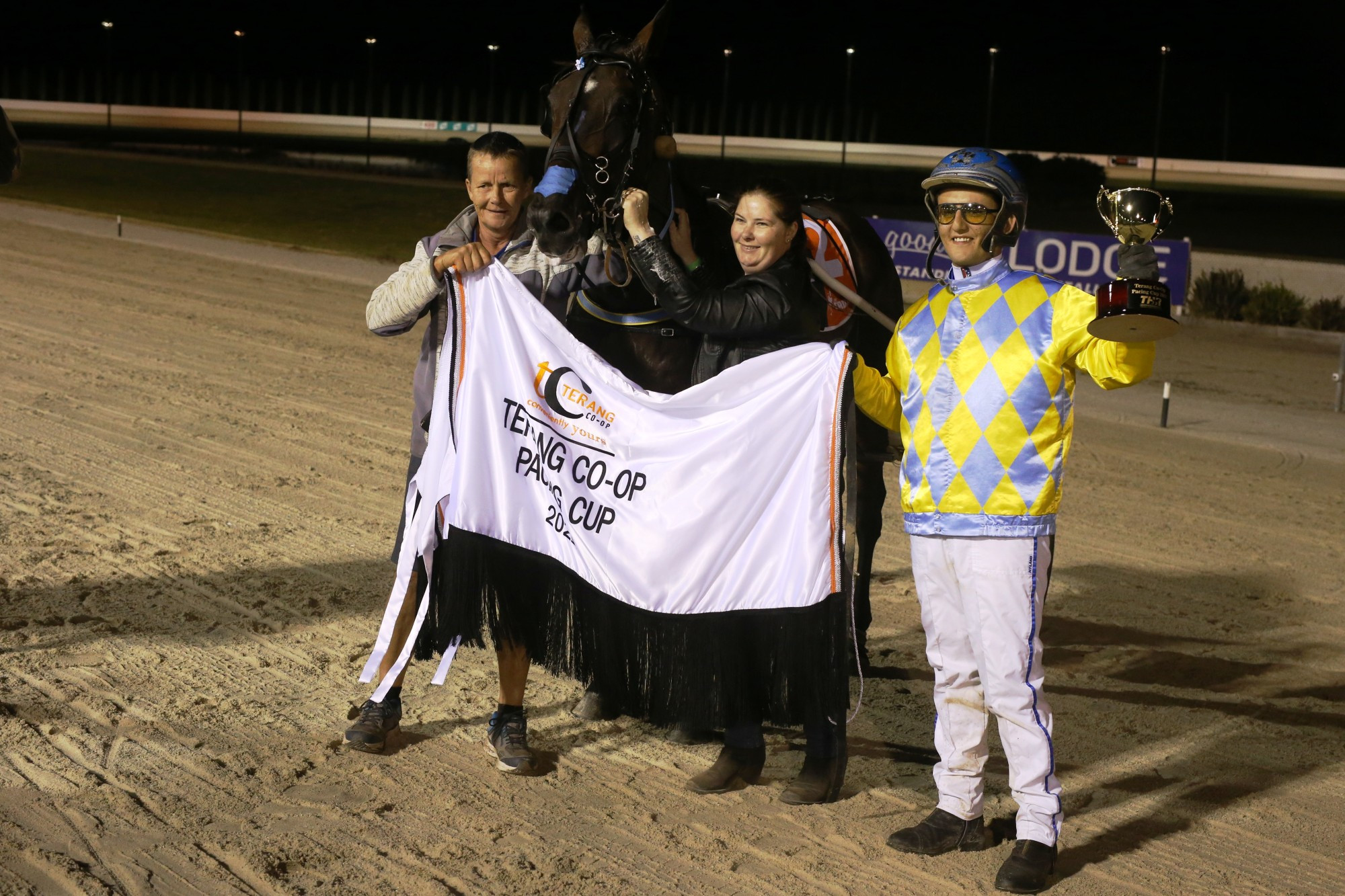 Connections of Wolf Stride celebrate the pacer’s victory in Saturday night’s $50,000 Terang Co-op Pacing Cup.