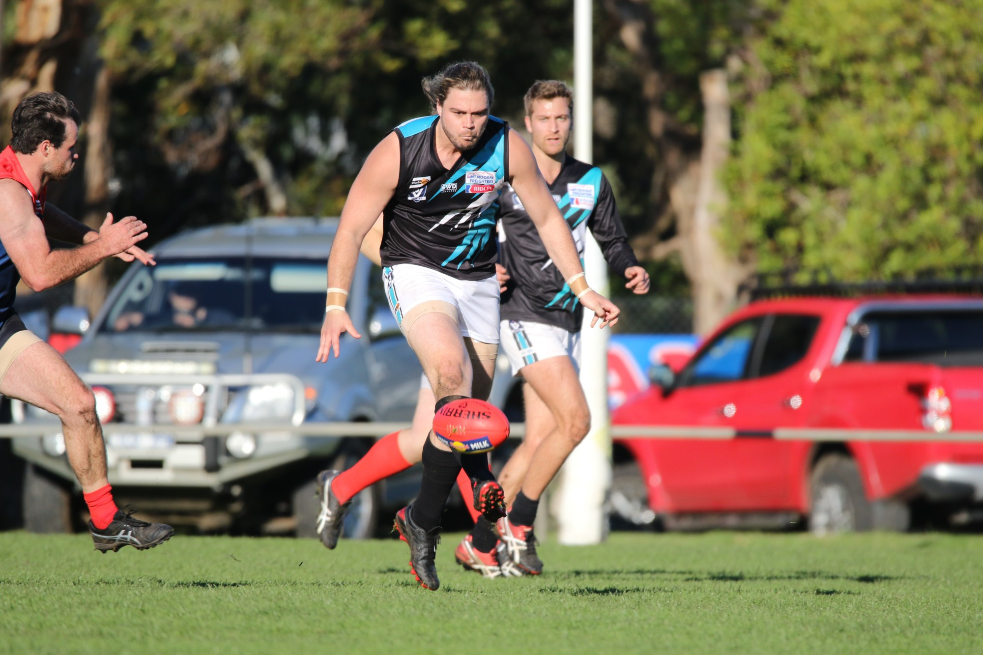 Milestone: Kolora Noorat’s Jake Richardson gets a kick away in his 100th match for the Power against Timboon last Saturday. The defender kicked a goal and was among the Power’s best in its thumping 144 point victory.