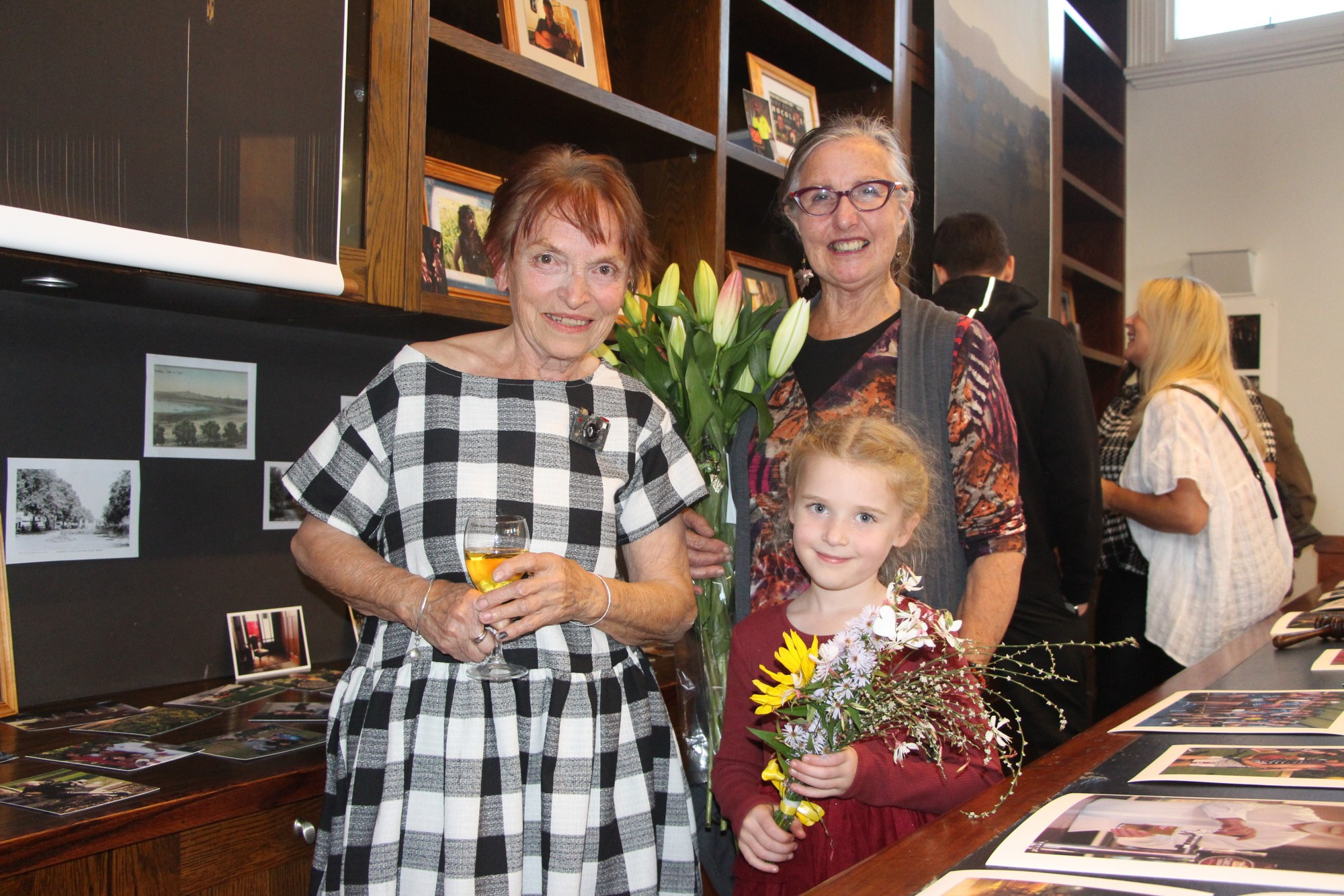 Through the lens: Photographer Christina de Water enjoyed a successful premier of her Postcards from Terang exhibition last week, along with the support of Jo Kenna and young poster star Elouise.
