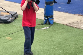Finding focus: Mikey Piscopo snapping a photo of some classmates and teachers. 