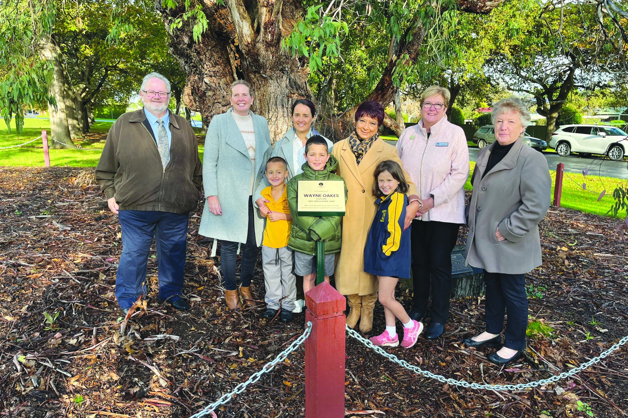 Former councillor Neil Trotter, Cr Jo Beard, Caitlyn Fitzgerald, Judi Oakes, Mayor Ruth Gstrein, former Cr Lesley Brown. Front, from left: Bronte, 5, Herbie 9, and Marlee, 7.