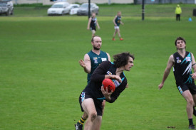 Jack Carlin marks near the boundary. 