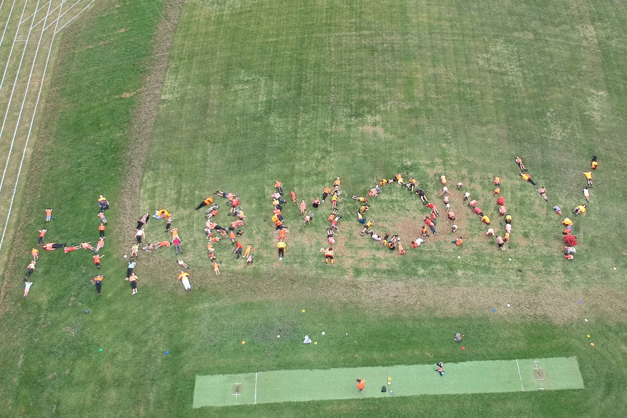 Everyone belongs: Students at Mortlake College joined together to spell out their support for diversity and inclusiveness as part of Harmony Week celebrations last week.